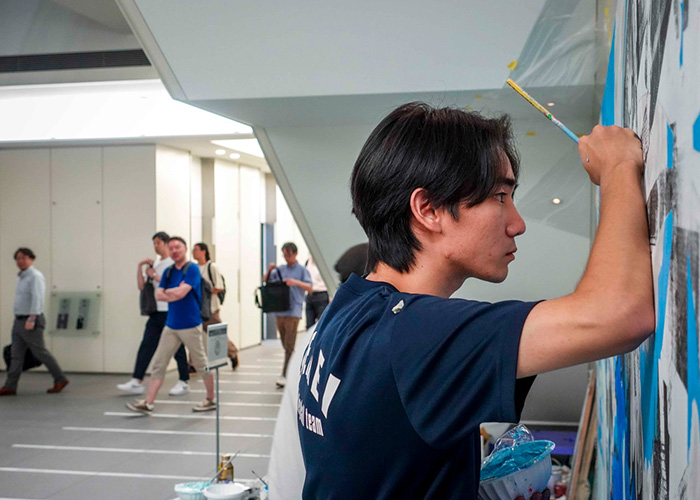 Photo of work being done on Mr. Ujitoshi Akasa's mural