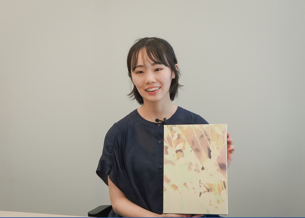 Ms. Kotori Nakamura with one of her past works