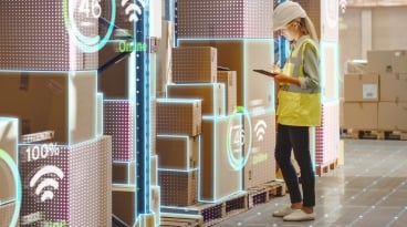 Warehouse worker locating package tags using a tablet