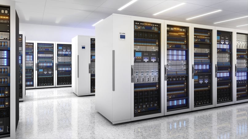 Server racks at a data center storage and network processing room.