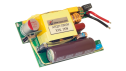 EBC10296 内部电源 PCB 的照片，展示了用于 AC‑DC 转换和电源调节的变压器、电容器、电感器、保险丝以及 USB 输出端口。