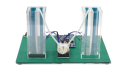 Back view of the capacitive touch liquid level indicator reference design with two transparent tanks, connecting tubes, sensors, and a CPU board and control board.