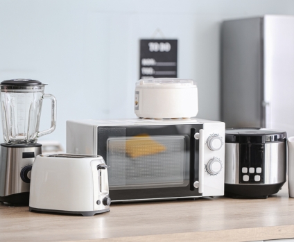 Household appliances on a kitchen countertop.