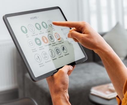 Woman using smart home controls on a digital tablet
