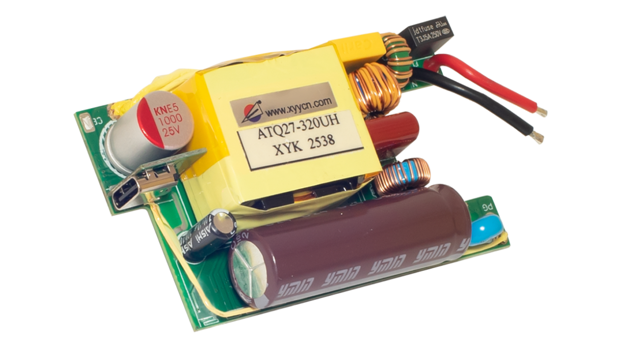 Photo of the EBC10296 internal power‑supply PCB showing the transformer, capacitors, inductors, fuse, and USB output port used for AC‑to‑DC conversion and power regulation.