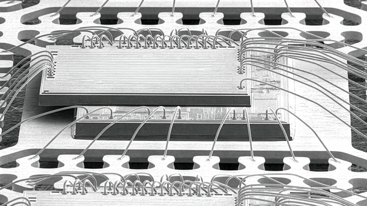 SEM‑style graphic illustrating a single‑package solution, showing a magnified, textured semiconductor package with detailed surface structure and edge features.